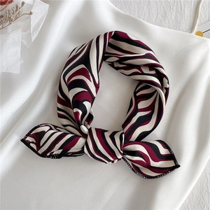 Elegant zebra striped satin silk neck scarf with black white and burgundy wave patterns
