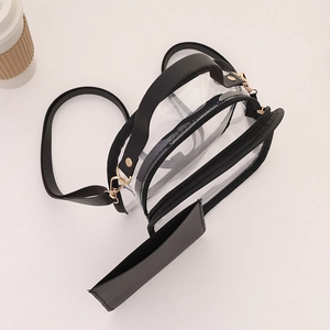 Modern transparent PVC jelly bag with black leather trim and adjustable strap