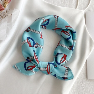 Elegant light blue satin square scarf with red horsebit chain print on white dress