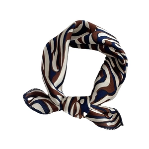 Silk satin square scarf featuring retro brown and blue zebra patterns on a white background