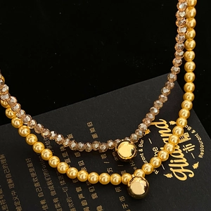 Double-layered gold pearl and champagne crystal necklace with sphere pendants