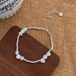Baroque freshwater pearl bracelet with S925 silver beads and heart pendant detail
