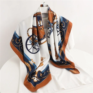Classic carriage print twill silk scarf in navy and caramel displayed on white shirt
