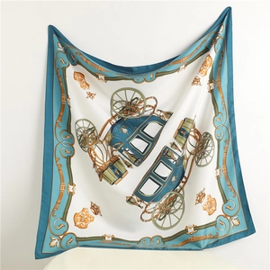 Detailed close-up of a twill silk scarf featuring classical carriage and chain patterns