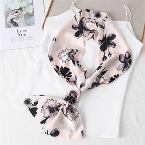 Elegant pink floral silk scarf for women shown tied on white silk top backdrop