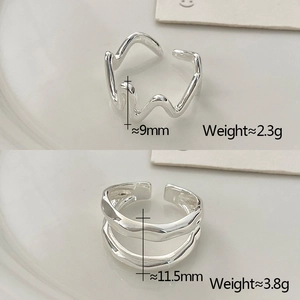 Detailed specs of two silver irregular wavy open rings with weight and width measurements