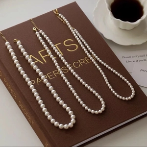 Elegant vintage French style round pearl necklace set with golden lobster clasp and extension