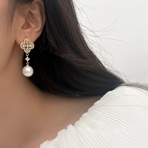French clover stud earrings with sparkling cubic zirconia and white pearl drops