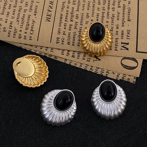 Vintage geometric cat-eye earrings in gold and silver with black oval gemstones