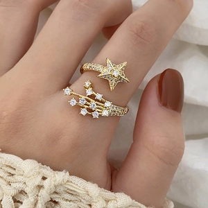 Exquisite 18K gold star open ring with micro-paved zircons and meteor trail design