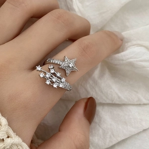 Sparkling zircon star open ring in silver finish worn on finger for casual luxury
