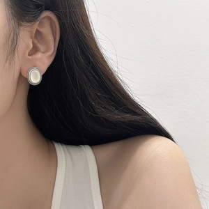 Minimalist silver oval cat's eye stud earrings shown on model for an elegant retro look