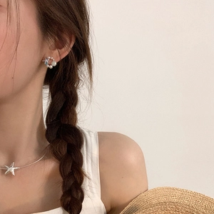 Orecchini a stella marina e conchiglia con perle per un look estivo da donna