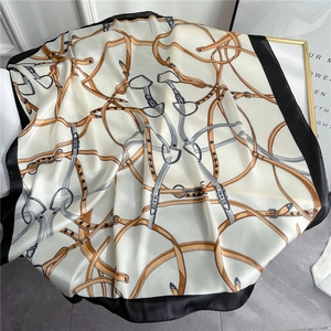 Elegant square silk scarf with classic horse harness and belt patterns on cream base