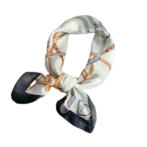 Elegant silk scarf with classic belt and buckle print in black, white, and orange
