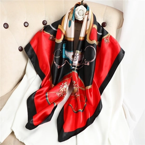 Detailed view of large satin silk scarf with vintage horse carriage and chain patterns