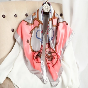 Elegant 90cm coral silk scarf with vintage carriage pattern on white shirt