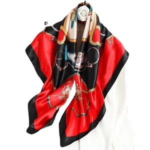 Classic carriage print satin square scarf in red, black, and cream with golden accents