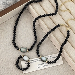Schwarze Facettierte Kristallperlen Halskette Armband Und Ring Mit Perlmutt Katzenkopf Charm Vergoldeter Eleganter Schmuck