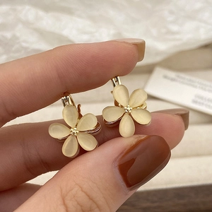Elegant gold flower hoop earrings with cat-eye stone petals and lever-back clasp