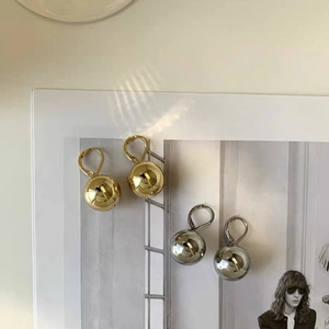 Minimalist French luxury round ball earrings in polished gold and silver finishes