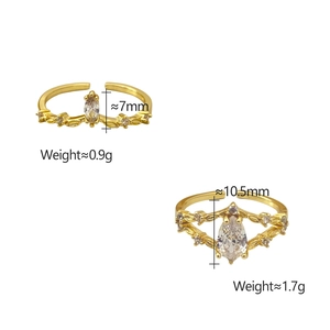 Detail of adjustable gold-plated crown ring and layered zirconia ring with pear-cut stone