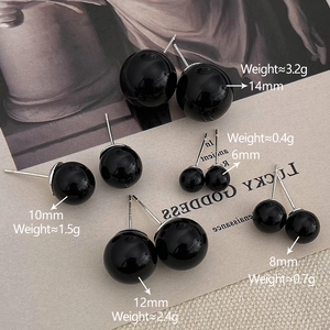 Detailed view of black pearl stud earrings in five sizes from 6mm to 14mm with silver pins