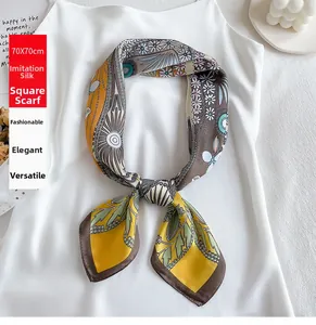 Detail of 70x70cm yellow faux silk square scarf with floral print on white top