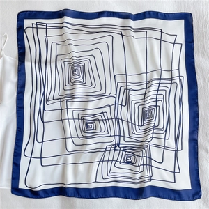 Square silk scarf with blue geometric spiral lines and navy border on white background