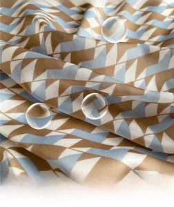 Macro view of geometric silk-like fabric showing breathable texture and blue pattern