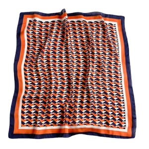 Silk-like square scarf featuring orange and navy geometric V-patterns with wide borders