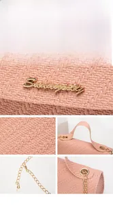 Detail of pink woven texture handbag with metal Sunnycity logo and gold chain strap