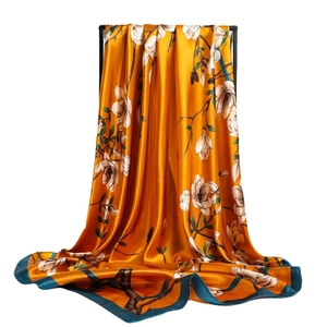 Carré de soie floral à base orange et bordure bleu sarcelle, motif magnolia chic