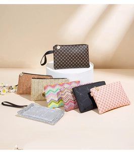 Collection of colorful wave pattern and woven clutch bags on elegant pedestal