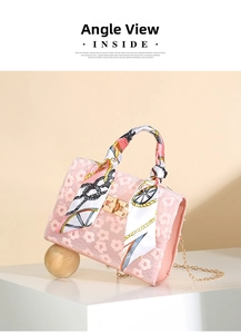 Detailed view of pink floral lace handbag with silk scarf handle and golden chain strap