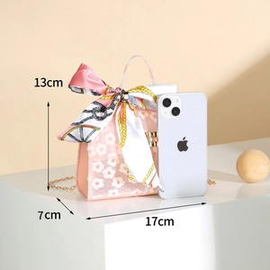 Detailed view of pink lace crossbody bag with scarf and chain, size 17x13x7cm