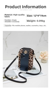 Detailed view of leopard print crossbody phone bag with gold crown emblem and size specs