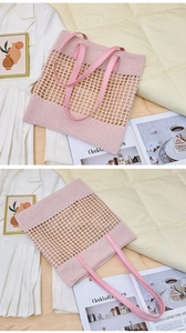 Detail of pink hand-woven crochet tote bag featuring hollow mesh and leather handles