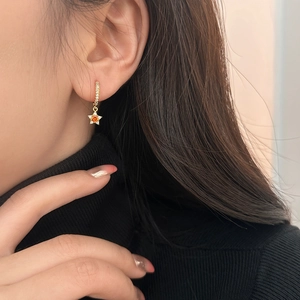 Exquisite gold star pendant hoop earrings with orange gemstones and sparkling zircons