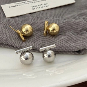 Minimalist gold and silver geometric ball earrings with polished metallic mirror finish