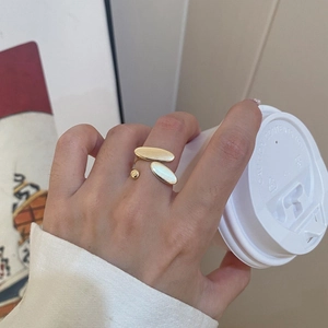 Minimalist gold plated adjustable open ring featuring geometric oval and ball design