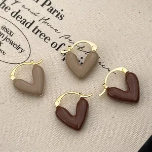 Vintage heart-shaped glaze earrings in taupe and chocolate brown with gold ring fasteners