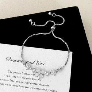 Elegant silver box chain bracelet with cat eye stone petals and zircon flowers