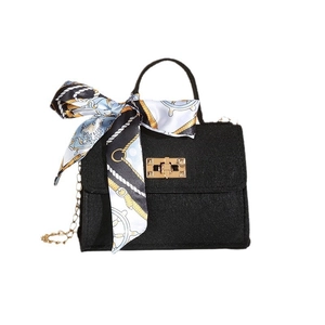 Chic black mini crossbody bag with golden clasp and nautical silk scarf decoration