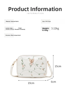 Detailed view of white floral embroidered bag with dimensions 19x6x15cm and 0.12kg weight