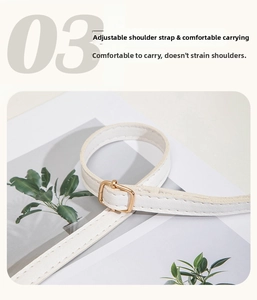 Detail of adjustable white leather strap with golden metal buckle and neat stitching