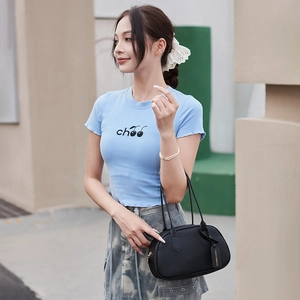 Women's black lychee pattern handbag with summer outfit and blue cherry print t-shirt