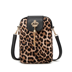 Crossbody leopard print phone bag with black leather flap and gold tassel crown