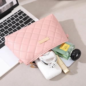 Pink quilted PU leather crossbody bag showing interior storage for makeup and accessories