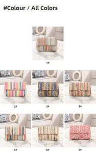 Close-up of seven colorful woven crossbody bags with metal buckles and gold chain straps